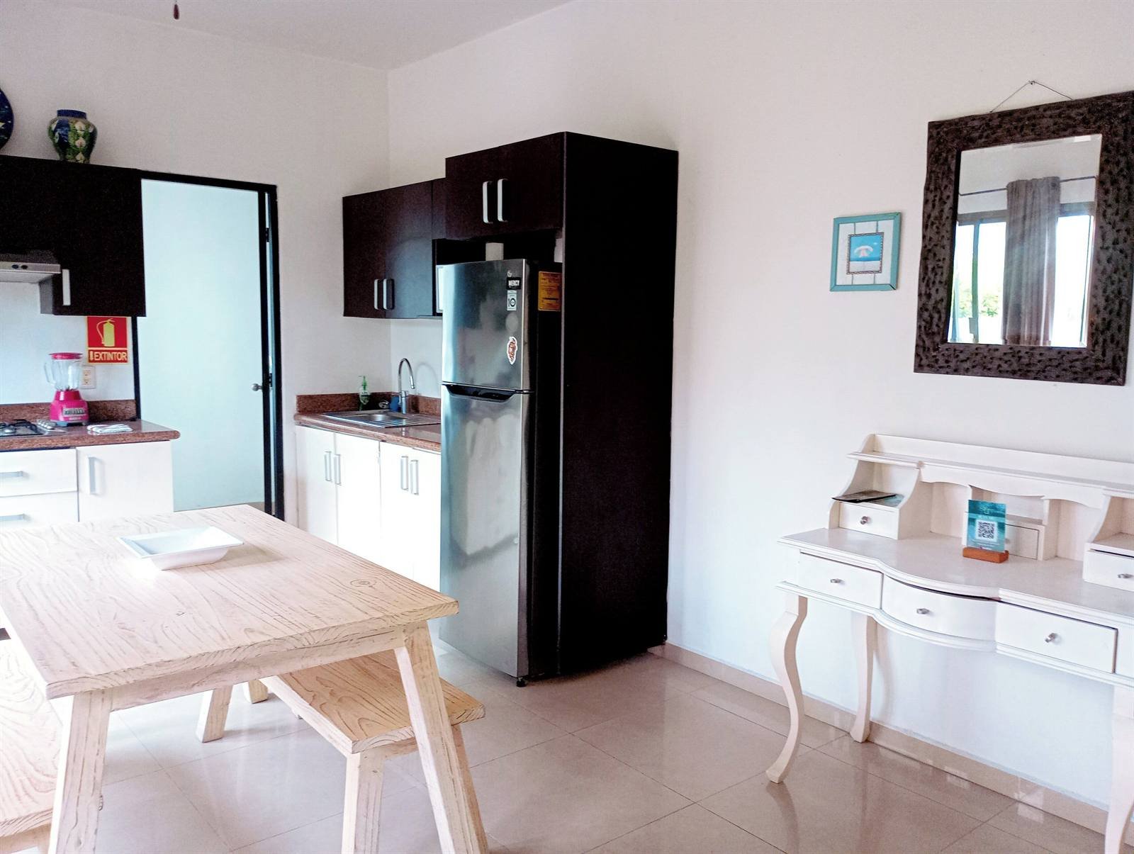 Villas Akalan: apartment kitchen with refrigerator and dining table